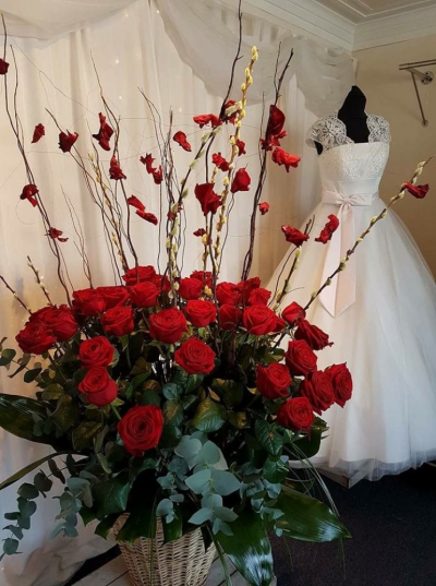 Red Rose Heaven - This stunning twist on a bunch of red roses created by Emma Dandy of Flowers of Kidderminster.

Long stemmed (70-80cm) Roses with Sallax (Willow) and petals, set with lush green and silvery-green foliage, arranged in a beautiful basket.

Emma has created the 'Fine & Dandy' collection of arrangement designs for when something truly stunning, beautiful and unique is required!

Created in the shop on Lisle Avenue with the freshest stems, Emma and her team will create this arrangement ready for collection or delivery.

Final arrangement may look different to the image and stems may be substituted when necessary but your arrangement will alway look stunning! The container is subject to availability and may be substituted.

Almost what you're after? We can tailor any bouquet to your needs and budget. Want to incorporate their favourite colours? Do you want to adapt the style to your needs and budget? All colours, styles and budgets can all be catered for.

Arrangements are available for same day delivery, when ordered before 2pm, in Kidderminster and the surrounding area. (Charges apply)