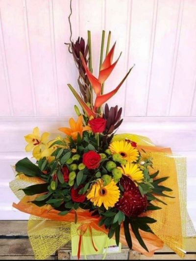 Tropical Sunshine - Brighten up her Mother's Day with this gorgeous arrangement in yellow, red and orange set with green foliage.

Arrangement contains Heliconia, Orchids, Roses, Gerberas, green Chrysanthemums and Strelitzia against green leaves.

Each bouquet is designed and created by professional, qualified, local florists, Emma and her team. The talented florists at Flowers of Kidderminster add a touch of pizazz and style to every bouquet, which is put together by hand, from scratch.

Almost what you're after? We can tailor any bouquet to your needs and budget. Want to incorporate their favourite colours? Do you want to adapt the style to your needs and budget? All colours, styles and budgets can all be catered for.

All flowers are subject to availability. Substitutes may be used but your bouquet will always look beautiful!

The arrangement can be delivered by Flowers of Kidderminster to addresses in Kidderminster and surrounding areas.