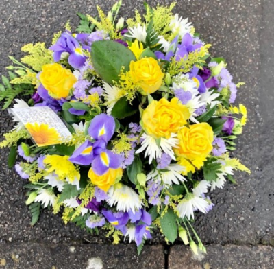 Natural Posy - Sympathy flowers are a beautiful way to let someone know that you are thinking of them at a sad time.

This natural posy of yellow and purple blooms includes roses, iris' and carnations set with delicate green foliage.

Each tribute is designed and created by professional, qualified, local florists, Emma and her team. The talented florists at Flowers of Kidderminster add a touch of style to every bouquet, which is put together by hand, from scratch.

Almost what you're after? We can tailor your tribute to suit your needs and budget. Want to incorporate their favourite colours? All colours, styles and budgets can all be catered for.

All flowers are subject to availability. Substitutes may be used but your tribute will always look beautiful!