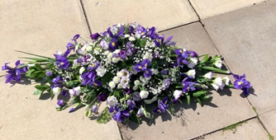 Purple and White 2ft Double-ended Spray - Beautiful double ended 2ft spray in purple and white. 

Funeral Tributes which reflect the personality and the life of the person sadly departed are created with care and attention by our team of qualified, professional and local florists.

This traditional double ended spray is a made-up in the florists' selection of stems in purples and whites.

Each tribute is designed and created by professional, qualified, local florists, Emma and her team. The talented florists at Flowers of Kidderminster add a touch of style to every bouquet, which is put together by hand, from scratch.

Almost what you're after? We tailor all funeral tributes to your specific requirements. We can incorporate their favourite colours or create a style that reflects their personality. Come in and talk to us about what you would like and we will create it for you.

All flowers are subject to availability. Substitutes may be used but your tribute will always look beautiful!

Funeral Tributes can be delivered on the day to a location of your choice.