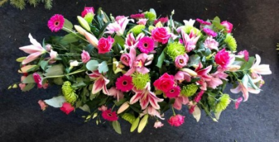 Coffin Spray Orchid, Lilies & Roses - Double ended Coffin spray of Orchids, Roses and Lilies in pinks and greens 

Funeral Tributes which reflect the personality and the life of the person sadly departed are created with care and attention by our team of qualified, professional and local florists.

This double ended spray is a made up in the florists' selection of stems can be made in 3ft, 4ft, 5ft or 6ft lengths. (Please call for 3ft)

Each tribute is designed and expertly prepared by professional, locally based, florists Emma and Laura. At this difficult time, Emma and her team are here to help choosing and ordering funeral flowers and sympathy tributes a little easier.

All arrangements are created from our collection of fresh flowers at our shop in Lisle Avenue, Kidderminster.

Almost what you're after? We tailor all funeral tributes to your specific requirements. We can incorporate their favourite colours or create a style that reflects their personality. Come in and talk to us about what you would like and we will create it for you.

All flowers are subject to availability. Substitutes may be used but your tribute will always look beautiful!

Funeral Tributes can be delivered on the day to a location of your choice.