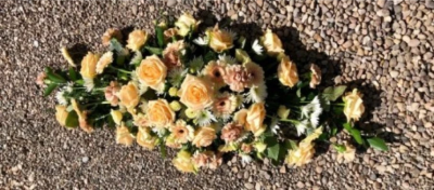 2 ft Peach Double-ended Spray - Beautiful double-ended 2ft spray in peach tones. 

Funeral Tributes which reflect the personality and the life of the person sadly departed are created with care and attention by our team of qualified, professional and local florists.

This traditional double ended spray is a made-up in the florists' selection of stems in peach tones.

Each tribute is designed and created by professional, qualified, local florists, Emma and her team. The talented florists at Flowers of Kidderminster add a touch of style to every bouquet, which is put together by hand, from scratch.

Almost what you're after? We tailor all funeral tributes to your specific requirements. We can incorporate their favourite colours or create a style that reflects their personality. Come in and talk to us about what you would like and we will create it for you.

All flowers are subject to availability. Substitutes may be used but your tribute will always look beautiful!

Funeral Tributes can be delivered on the day to a location of your choice.