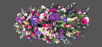 Summer Casket Spray Purple and Pink - This summer flower, double-ended coffin spray is made up in the florists' selection of pink, purple and cream stems including Roses, Lilies, Hydrangea, Gerbera and Carnations against green foliage.

This spray is available in 2 different lengths; 5ft or 6ft.

Funeral Tributes which reflect the personality and the life of the person sadly departed are created with care and attention by our team of qualified, professional and local florists.

Express condolences and pay tribute with this spray, expertly prepared by professional, locally based, florists Emma and Laura. At this difficult time, Emma and her team are here to help make choosing and ordering funeral flowers and sympathy tributes a little easier.

All arrangements are created from our collection of fresh flowers at our shop in Lisle Avenue, Kidderminster. 

Almost what you're after? We tailor all funeral tributes to your specific requirements. We can incorporate their favourite colours or create a style that reflects their personality. Come in and talk to us about what you would like and we will create it for you.

All flowers are subject to availability. Substitutes may be used but your tribute will always look beautiful!

Funeral Tributes can be delivered on the day to a location of your choice.