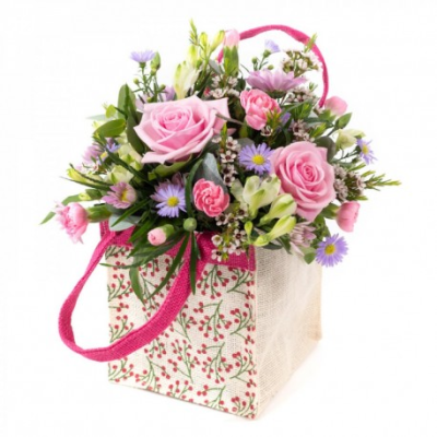 A Little Treat - Show your affection with this mouth-watering mix of classical flowers delivered in a delightful gift bag or box.