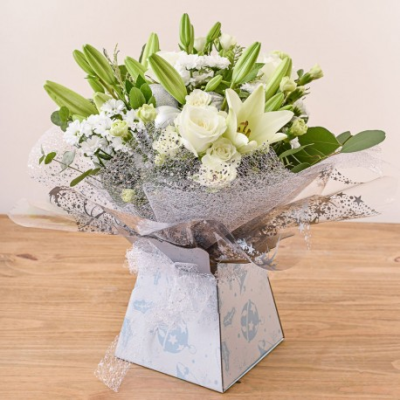 Ivory Elegance - Inspired by Nature in Whites and Creams set within fresh green foliage, handtied and presented in a gift box with ribbon.

A wonderful clean, fresh looking bouquet of White Roses, Lilies and Chrysanthemums.